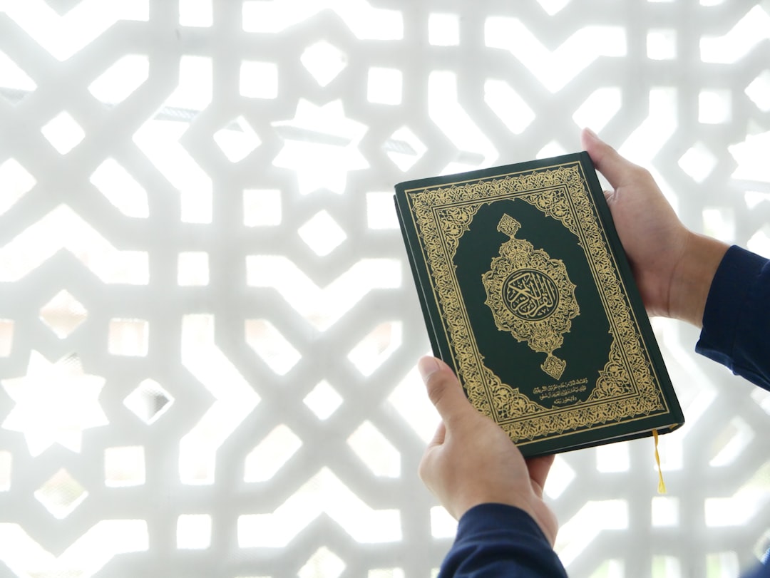 about-us-01 a-person-holding-a-book-in-their-hand-vck-efnqxim
